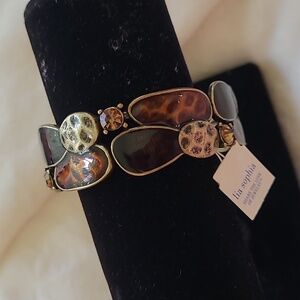 Lia Sophia Wild Thing stretch bracelet w/brass, black and brown tones.